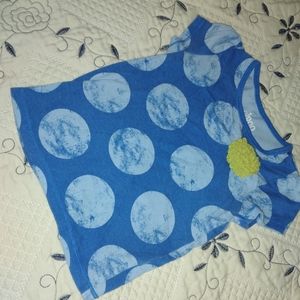 Blue shirt with no sleeve and with light blue dots and a flower